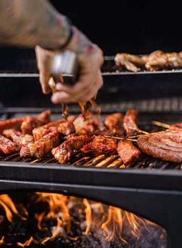 An up close image of a chef preparing Calgary Stampede BBQ catering